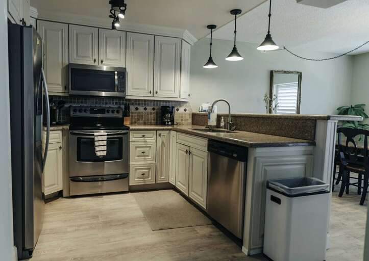 Enjoy a fully equipped kitchen in this comfortable beach stay, featuring stainless steel appliances,