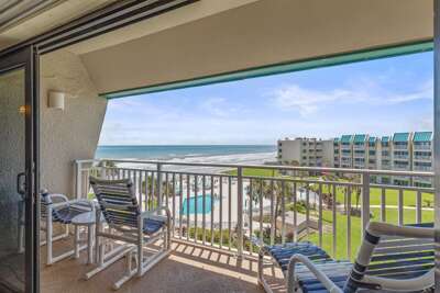 Relax on your private oceanfront balcony with sweeping beach views, resort-style pool access, and