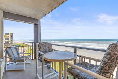 Relax on this oceanfront balcony beach stay, featuring sweeping shoreline views, fresh sea breeze, and comfortable seating—perfect for morning coffee or sunset unwinding by the waves.