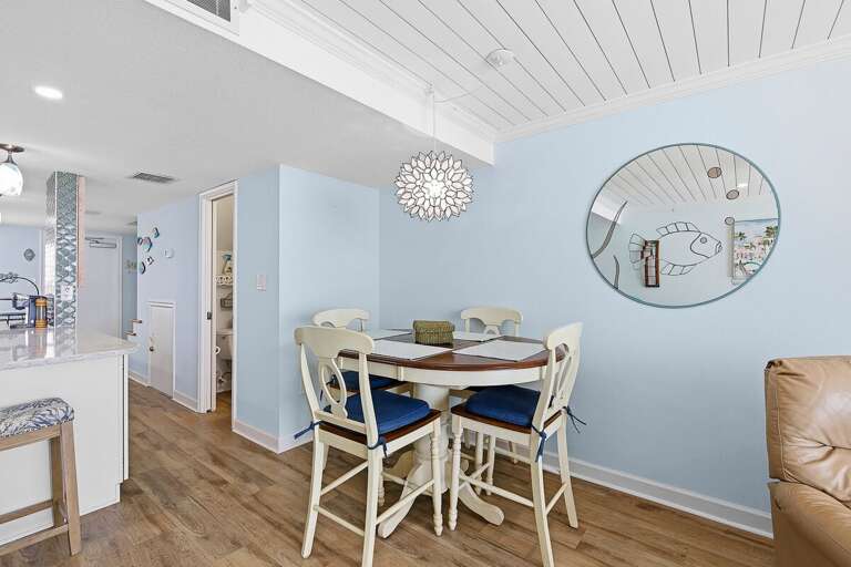 Enjoy meals in this charming beach stay dining area featuring coastal décor and a relaxed atmosphere. Perfect for gathering, dining, and making memories after a day by the ocean.