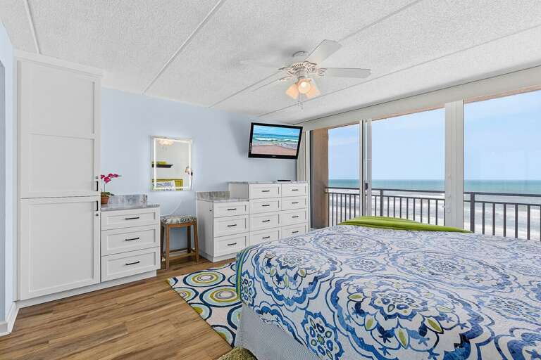 Wake up to stunning ocean views in this beach stay bedroom with direct balcony access. Enjoy coastal comfort, bright décor, and the soothing sounds of the waves right outside your door.