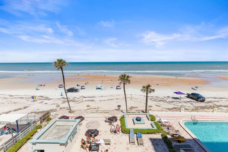 Take in stunning oceanfront views overlooking the pool and sandy shoreline at this beach stay. Relax