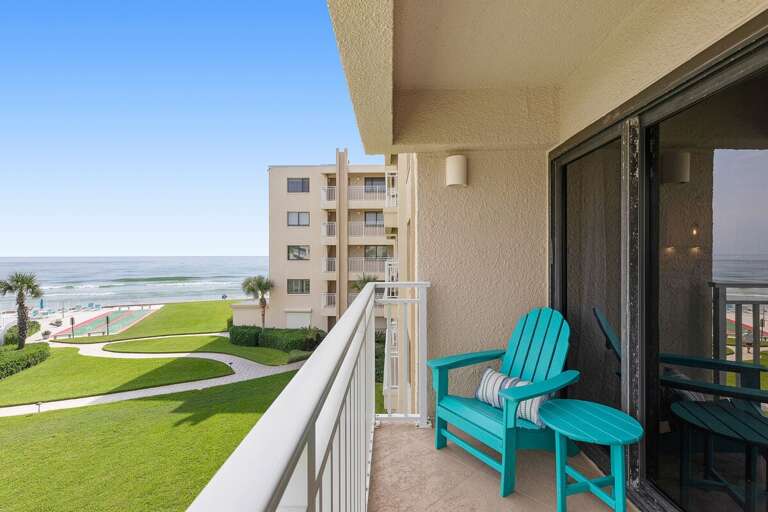 Soak in sweeping ocean views and coastal breezes from your private balcony featuring comfortable seating and peaceful resort surroundings—ideal for a relaxing beachfront beach stay.