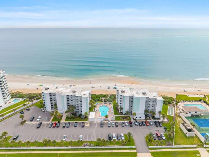 Enjoy the best beach stay at Shorehom by the Sea, featuring a sparkling pool, lush tropical grounds,