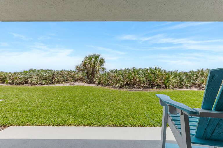 Step onto your private ground-floor patio and relax with peaceful ocean breezes and lush tropical