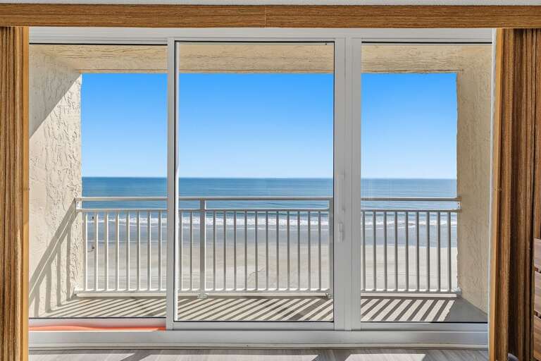 Step outside to stunning direct oceanfront views from the private balcony, overlooking the sandy