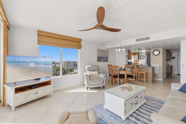 Unwind in this spacious coastal living area with comfortable seating, an open dining space, and