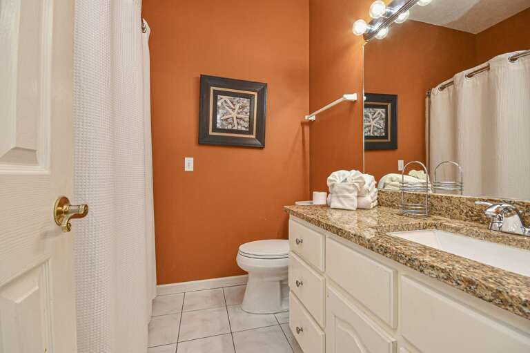 Cozy bathroom with warm tones and granite countertop