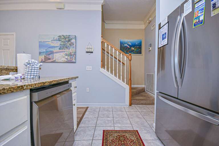 Bright, modern kitchen with stainless steel appliances and cozy dining nook