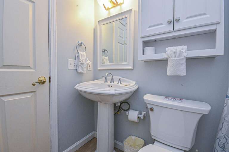 Bright and clean bathroom with classic pedestal sink