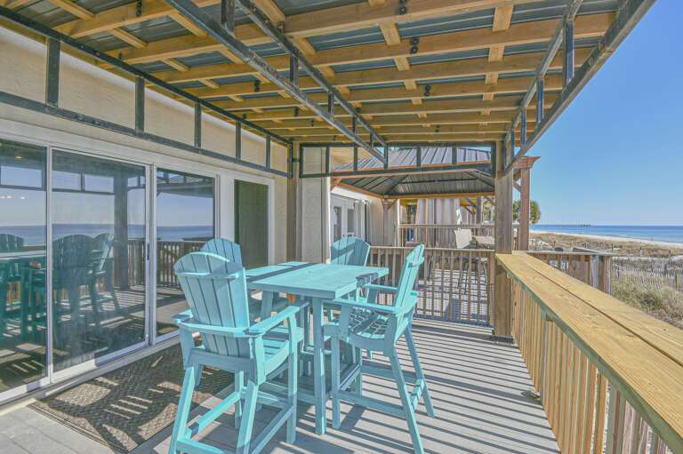 Spacious balcony with panoramic views and vibrant seating