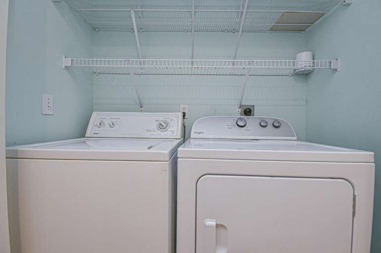 Bright, organized laundry room with modern washer and dryer