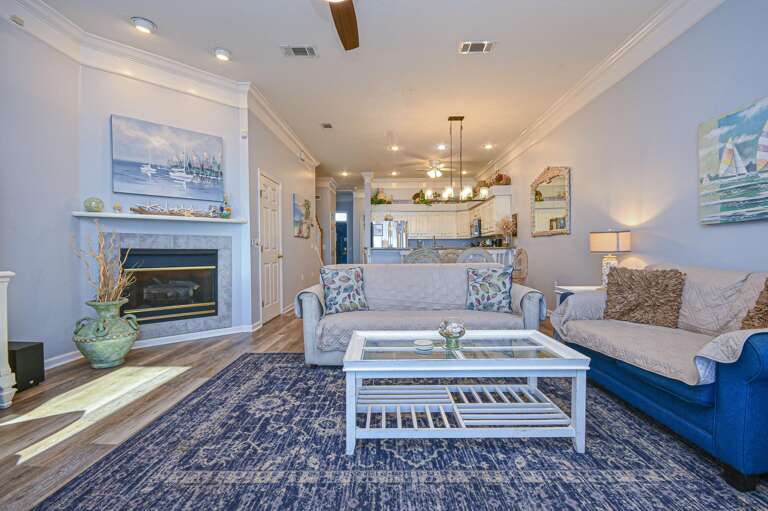 Cozy living room with fireplace and open kitchen flow