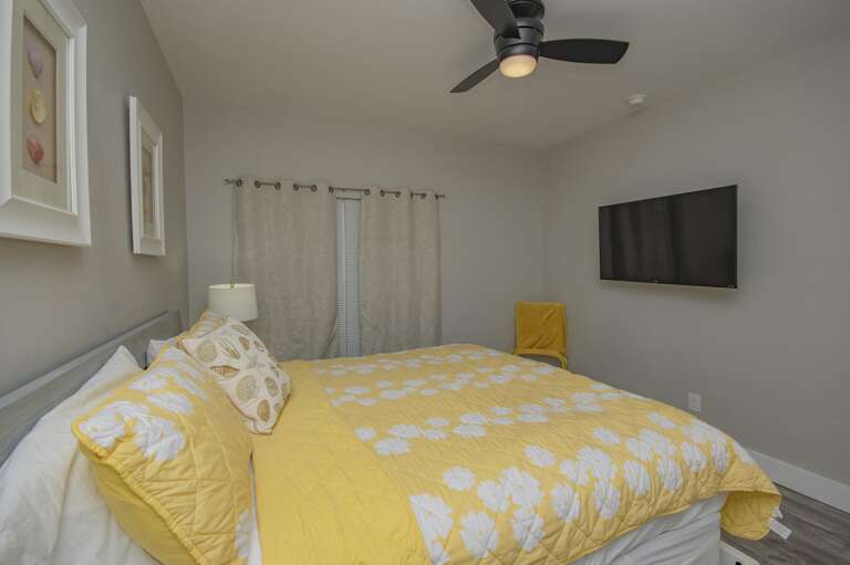 Cozy bedroom retreat with vibrant yellow accents and modern comfort