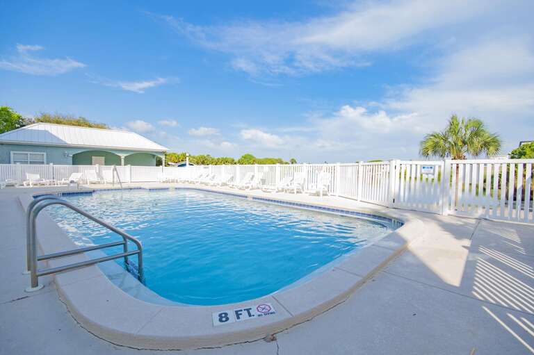Sun-soaked pool deck with panoramic sky views
