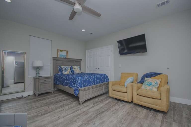 Cozy bedroom retreat with modern comfort and seating area