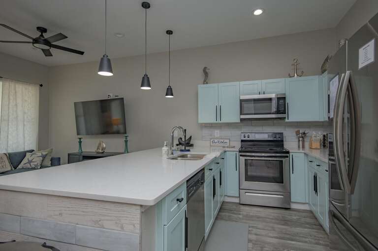 Modern kitchen with spacious island and stainless steel appliances