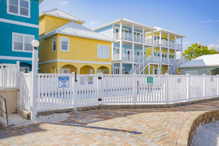 Sunny patio with private pool and vibrant coastal charm