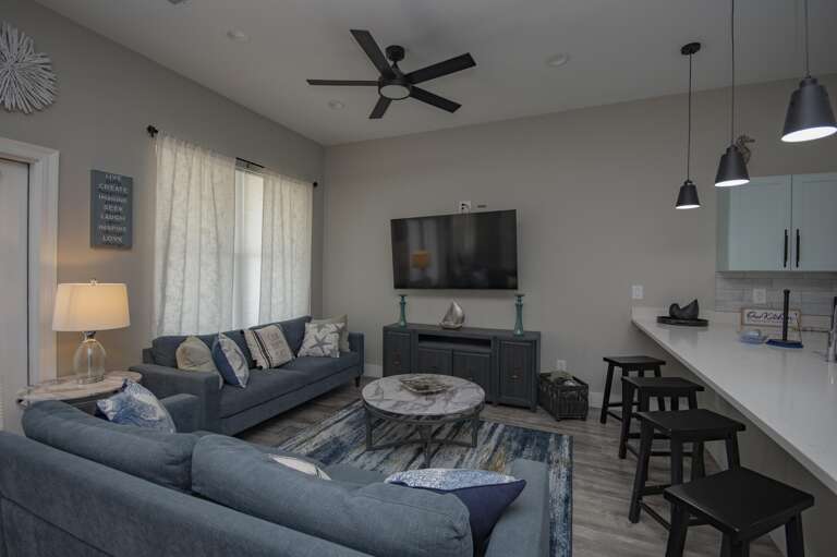 Cozy living room with plush seating and modern entertainment