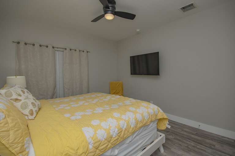 Cozy bedroom retreat with vibrant yellow accents and modern comfort