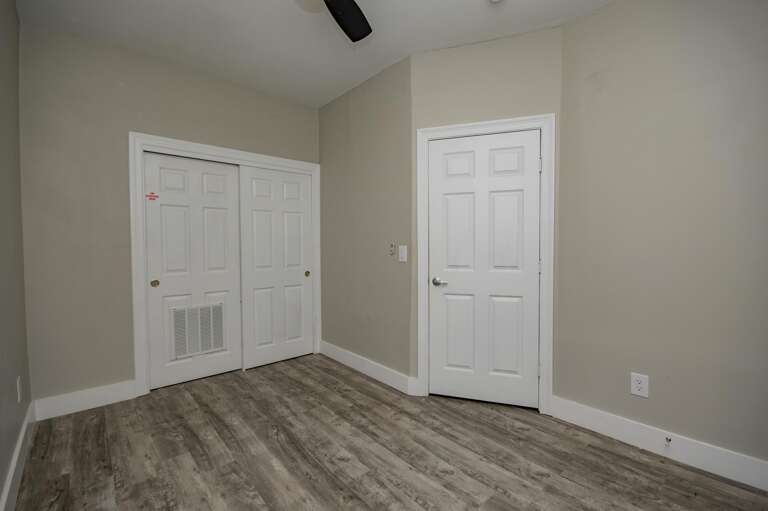 Cozy bedroom with modern flooring and neutral tones