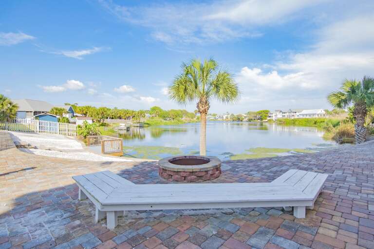 Lakeside patio with cozy fire pit and serene views