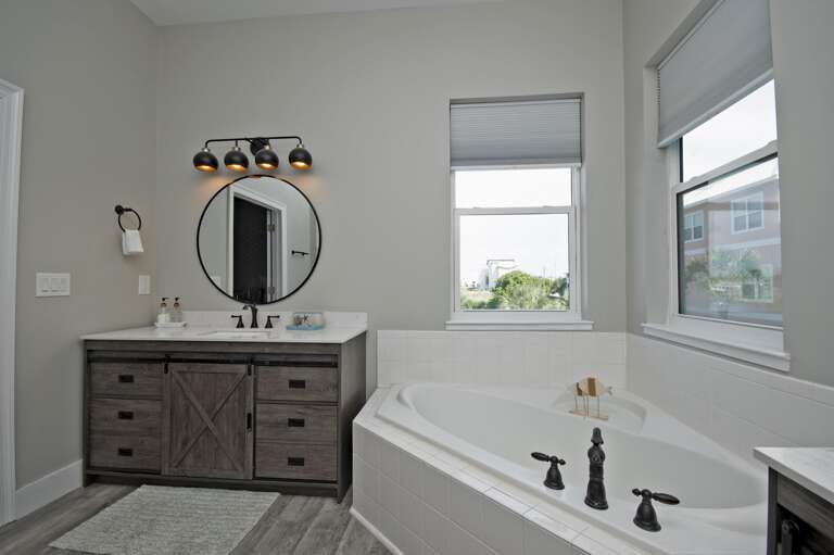 Spa-like bathroom retreat with soaking tub and modern vanity