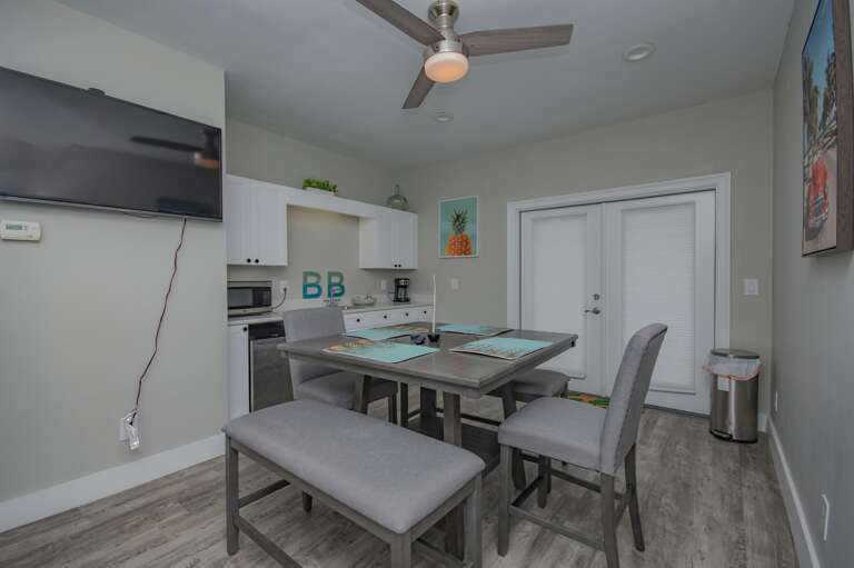 Bright, modern kitchen and dining area with cozy seating