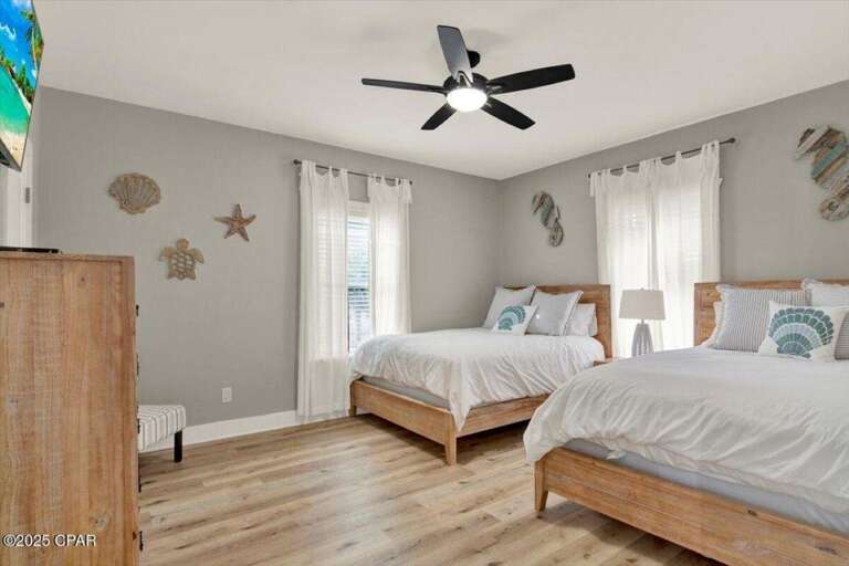 Cozy bedroom retreat with coastal-inspired decor and natural light