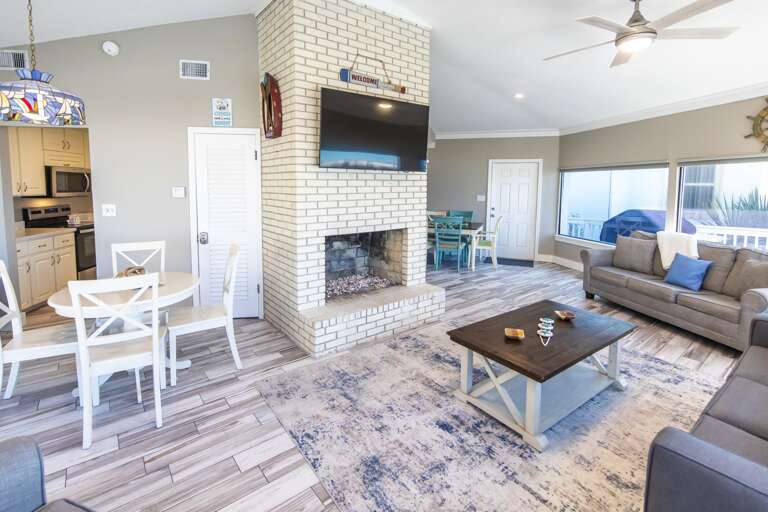 Spacious living room with cozy fireplace and natural light