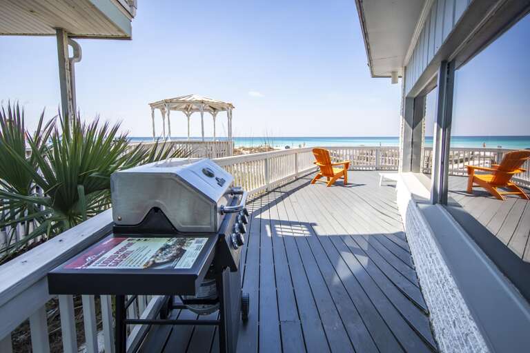 Spacious oceanfront deck with grill and sunset views