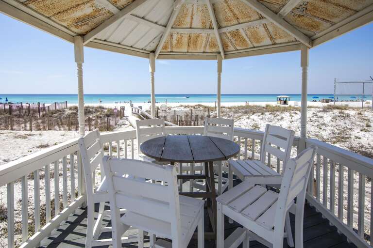 Seaside gazebo with panoramic ocean views and cozy seating