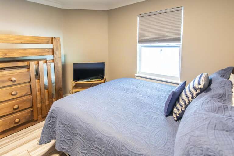 Cozy bedroom retreat with ample storage and natural light
