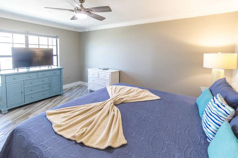 Cozy bedroom retreat with modern amenities and natural light