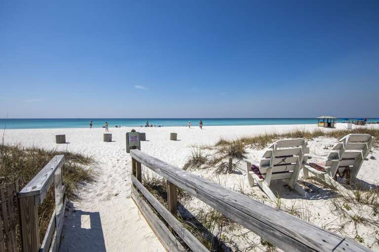 Private boardwalk leading to pristine white sand beach and turquoise waters