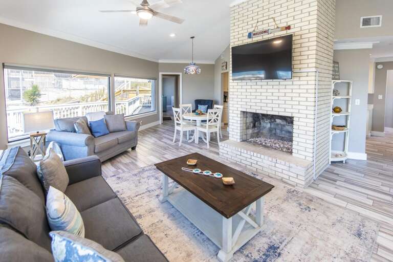 Spacious living room with cozy fireplace and scenic views
