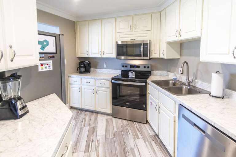 Bright, modern kitchen with stainless steel appliances and ample counter space