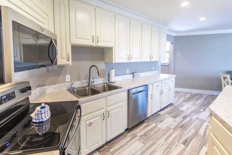Bright, modern kitchen with stainless steel appliances and spacious countertops