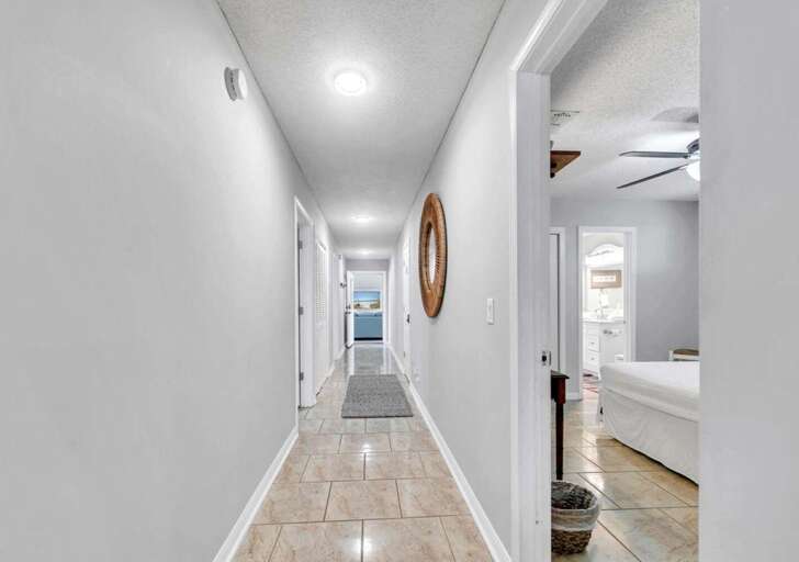 Bright, spacious hallway leading to cozy bedrooms and living areas