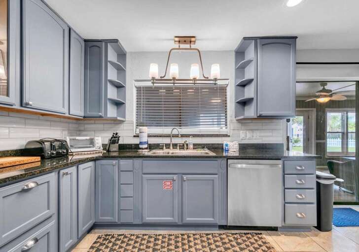 Bright, modern kitchen with ample storage and natural light