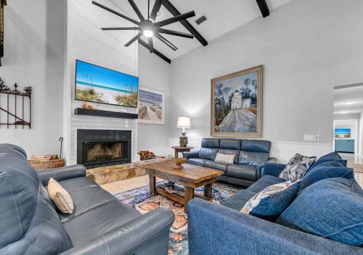 Spacious living room with vaulted ceilings and cozy fireplace