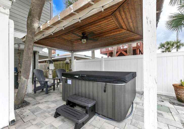 Private hot tub retreat under shaded pergola for ultimate relaxation