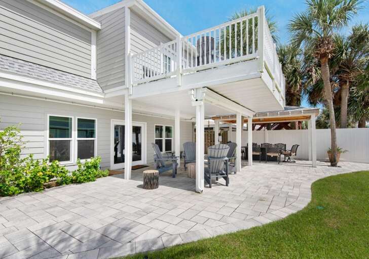 Spacious outdoor patio with shaded dining and lounge areas Spacious outdoor patio with shaded dining and lounge areas