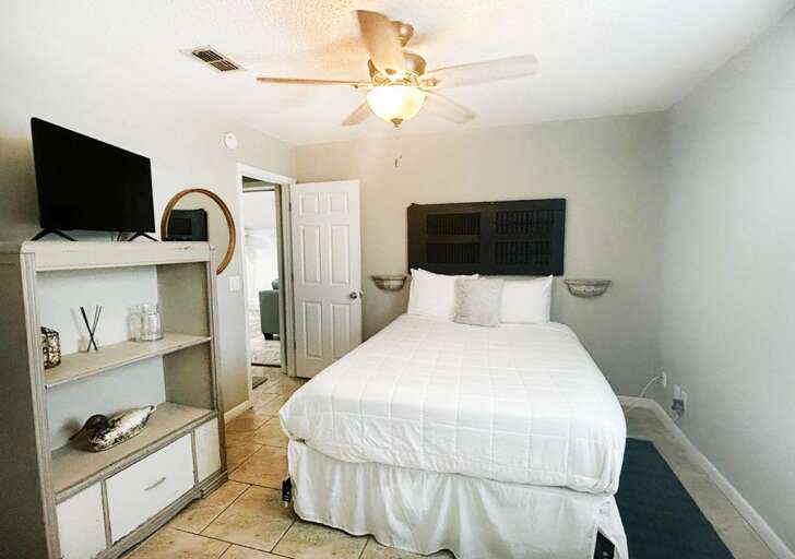 Cozy bedroom retreat with smart TV and serene decor