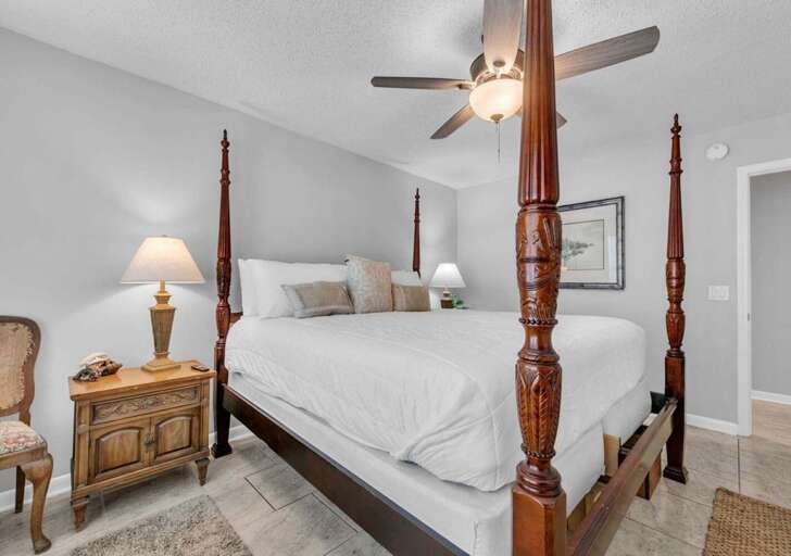 Cozy bedroom retreat with classic four-poster bed and soft lighting