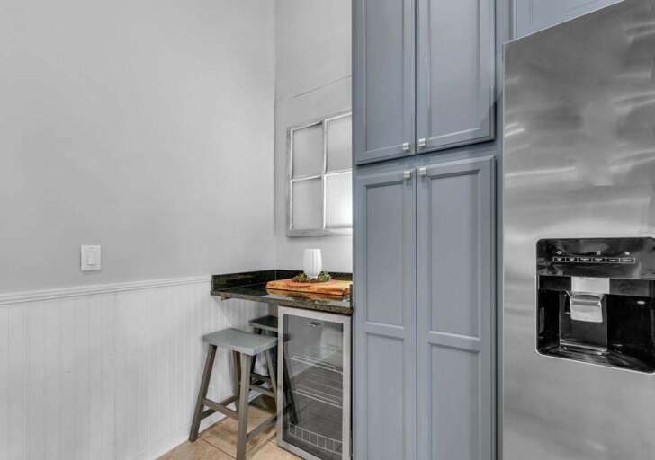 Cozy kitchen nook with modern appliances and seating