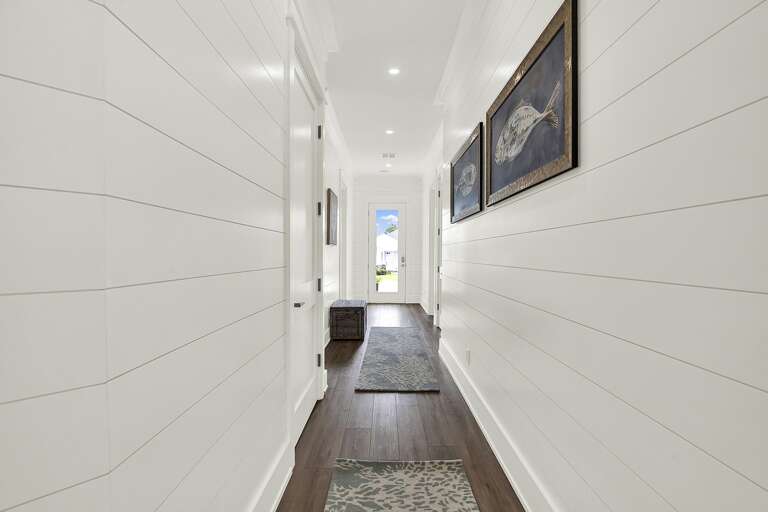 Bright, airy hallway leading to your cozy retreat