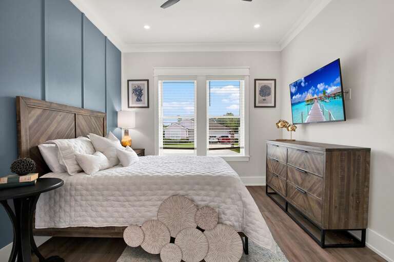 Bright and airy bedroom with scenic window views and modern comfort