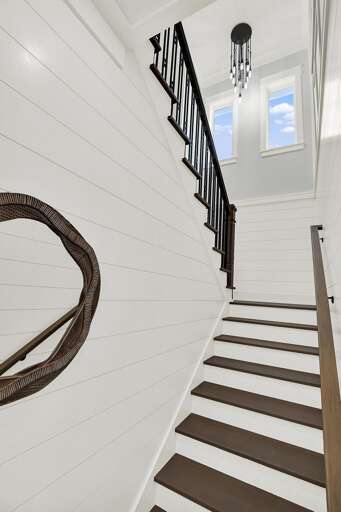 Bright, airy staircase with modern black-and-white contrast