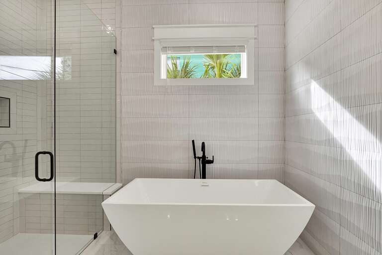 Modern bathroom retreat with freestanding tub and sleek fixtures